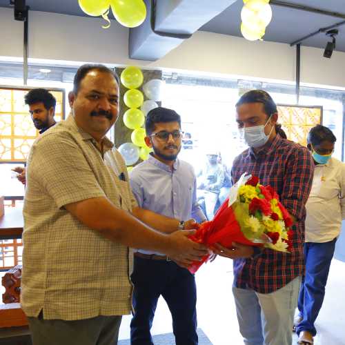 Mr.Faisal NK receiving the bouquet at Inauguration of Hyderabad Studio